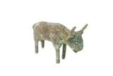Vintage African oxidized copper bull sculpture with a textured, aged green patina.