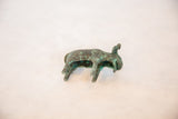 High-angle view of the vintage African copper bull, showing its rustic, oxidized finish.