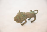 Vintage African copper wild thing figurine with green patina and textured surface.