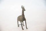 Vintage African giraffe sculpture showing its chubby, stylized form and patina.