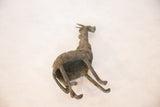 Angled top-down view of the vintage copper giraffe, showing its hollow construction and patina.