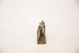 Frontal view of the vintage African copper person showing its handmade form and aged patina.