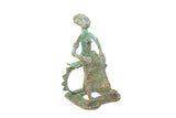 Vintage African oxidized copper figurine of a stylized sitting woman with a green patina.