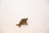 Angled view of the vintage bronze fish pendant highlighting its mesh texture.