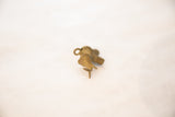 Vintage African elephant pendant viewed from an angle, showing its oxidized bronze texture.