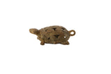 Vintage African bronze turtle pendant with a detailed, coiled wire openwork shell.