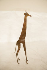 Full profile view of the tall vintage copper giraffe highlighting its slender handmade form.