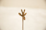 The sculpted ears and horns of a vintage African copper giraffe collectible.