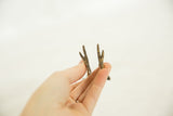 Detail of the vintage bronze ostrich's rustic, two-toed feet showing a handmade finish.