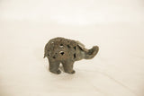 Side view of the vintage African wire elephant's coiled and openwork body design.
