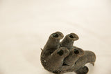 Close-up of the intricate wrapped wire and aged patina on an African elephant sculpture.
