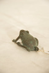 Vintage African copper frog showing rich green-brown patina and textured surface.