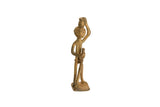 Vintage African bronze tribe member figurine standing with a staff and balancing a pot.