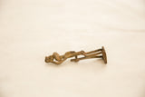 Full length side profile of the vintage African bronze figurine, highlighting its handmade charm.