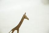 Detailed view of the African bronze giraffe's head, highlighting its aged patina.