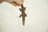 Overhead view of the vintage bronze alligator highlighting its scaly, segmented texture.