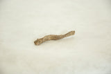 Textured surface of a vintage African Bronze Eel, highlighting its unique artisanal charm.