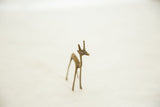 Slender vintage African bronze gazelle fawn, handmade with textured patina.