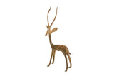 Vintage African copper gazelle sculpture with an alert stance and aged patina.