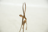 Close view of the vintage copper gazelle's alert head, showing its rustic handmade patina.