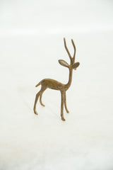 Side view of the vintage bronze gazelle showing its slender form and handmade texture.
