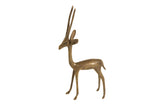 Vintage African bronze gazelle sculpture with a slender form and aged patina.