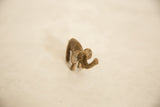 Handmade African bronze elephant, textured surface with aged patina.