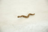 Textured bronze body of the vintage African striped snake sculpture.
