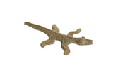 Vintage African bronze striped lizard sculpture with a textured, aged patina.