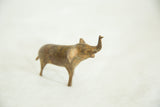 Vintage handmade speckled metal elephant with trunk raised.