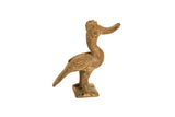 Vintage handmade African bronze bird sculpture with a curved beak and weathered patina.
