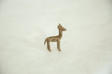Side view of the vintage bronze antelope calf with its unique, textured patina.