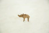 Profile view of a vintage bronze elephant showing its handmade texture and patina.