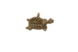 Vintage African left-facing bronze turtle pendant with an open mesh shell.