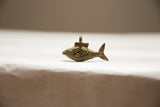 African oxidized bronze fish pendant with detailed handmade mesh pattern.
