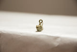 Front view of a handmade bronze fish pendant showing its oxidized mesh texture.