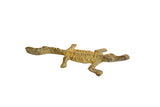 Vintage African bronze crocodile sculpture with a textured light back and curved tail.