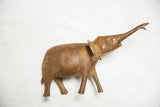 Vintage African bronze elephant with trunk raised, showcasing its full figure and rich patina.
