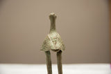 Rear view of the vintage African bronze stork showing its textured patina and sculpted wings.