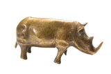 Collector's vintage African handmade bronze rhino with golden patina, 6.5 inches long.