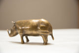 Golden patina on the back of vintage African bronze rhino figurine.