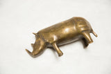 Vintage bronze rhino's warm golden patina and distinctive, aged sculptural details.