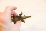 Hand-held vintage African bronze crocodile, revealing its dark textured patina.