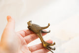 Vintage African dark bronze lion with rich, handmade textured surface.