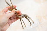 Handmade vintage bronze gazelle sculpture showing its slender form and patina.