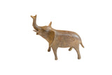 Vintage handmade African bronze elephant sculpture with trunk raised and aged patina.