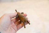 Rear view of the handmade bronze elephant, showing its speckled patina and tail.