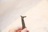 Vintage African bronze giraffe sculpture, highlighting dark patina and etched neck details.