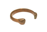 Antique African bronze cuff bracelet with a heavy form and a rich, natural patina from age.