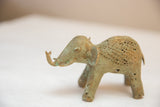 Handmade African elephant sculpture, time-softened bronze with mesh design and green patina.